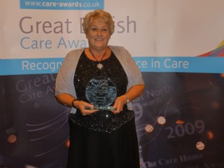 Carol with her award